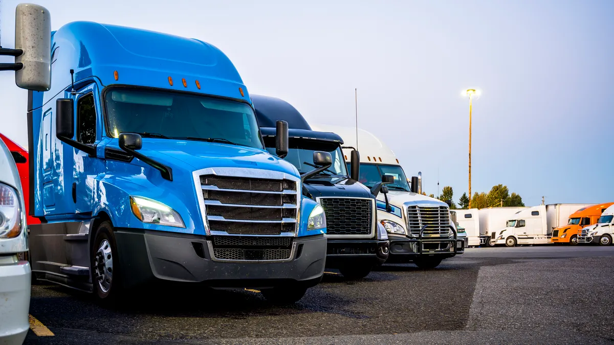 Trucks parked at a stop